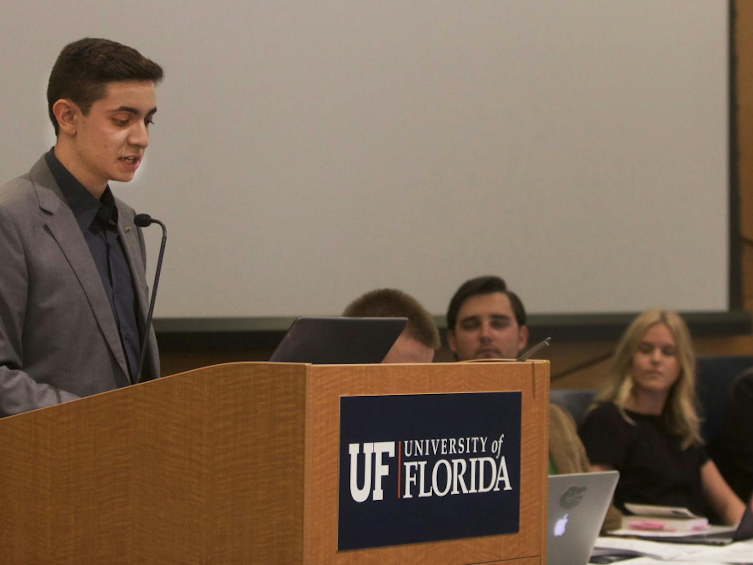 Mauricio Perez announces he is disaffiliating from the Impact Party during the final Student Government Senate meeting of the summer in the Reitz Union chamber room August 6.