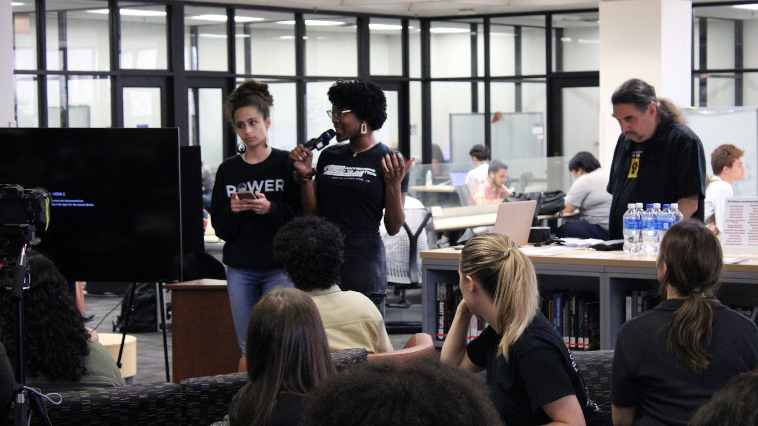 Sophia De La Cruz (left) and Krystin Anderson (right) speak to attendees at the Samuel Proctor Oral History Program’s teach-in session about black history and intellectual freedom in Marston Science Library Thursday, February 23, 2023.