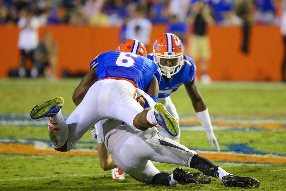 Dante Fowler Jr. (6) tackles Missouri quarterback Maty Mauk during Florida's 42-13 loss to Missouri.