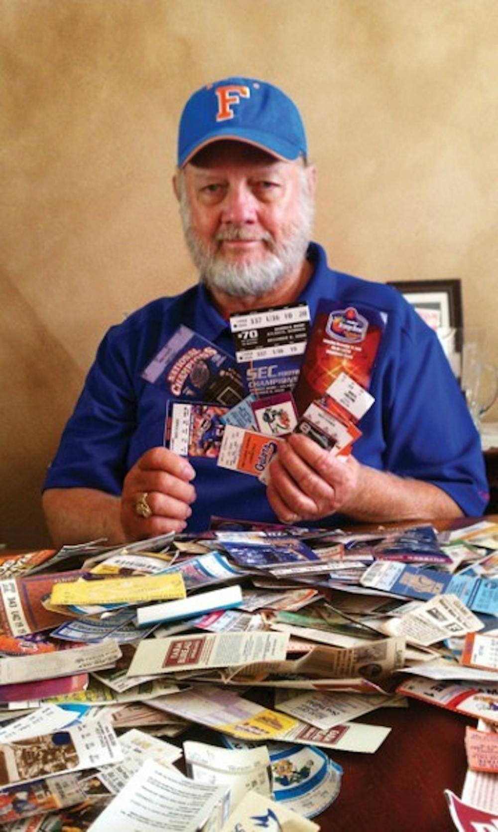 <p>Don Crews shows off his UF football ticket stubs. On Saturday, he attended his 500th Gators football game.</p>