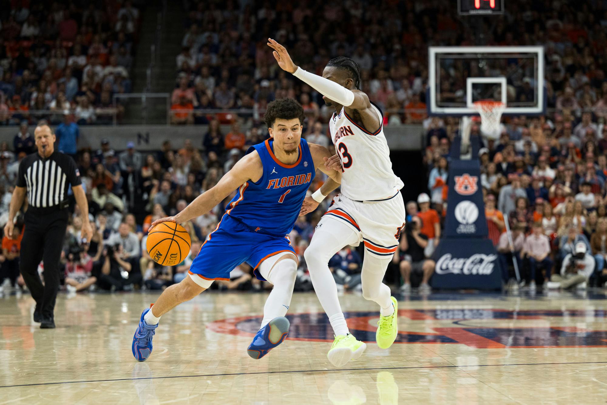 Florida Gators guard Walter Clayton Jr. (1) drives with the ball in a basketball game against Auburn University on Feb. 8, 2025, in Auburn, Ala.