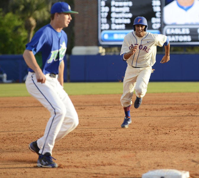 Senior Vickash Ramjit runs to third base during Florida’s 8-3 loss to Florida Gulf Coast on Saturday at McKethan Stadium. Ramjit had two hits in Florida's 4-1 loss to Indiana on Friday.&nbsp;