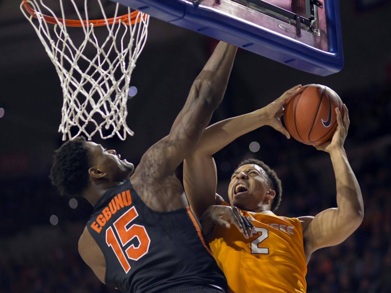 Florida center John Egbunu (15) fouls Tennessee forward Grant Williams (2) on this shot attempt during the first half of an NCAA college basketball game in Gainesville, Fla., Saturday, Jan. 7, 2017. (AP Photo/Ron Irby)