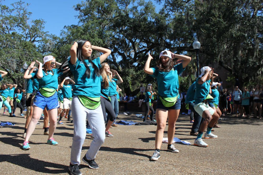 <p>The Florida Cicerones perform a flash mob dance on Turlington Plaza on Monday afternoon as promotion for its Fall forum. The forum will take place at 6 p.m. today in Emerson Alumni Hall.</p>