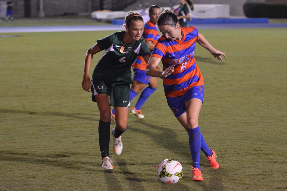 <p>Junior midfielder Lauren Smith dribbles the ball during Florida's 3-0 win against Miami on Friday at James G. Pressly Stadium.</p>