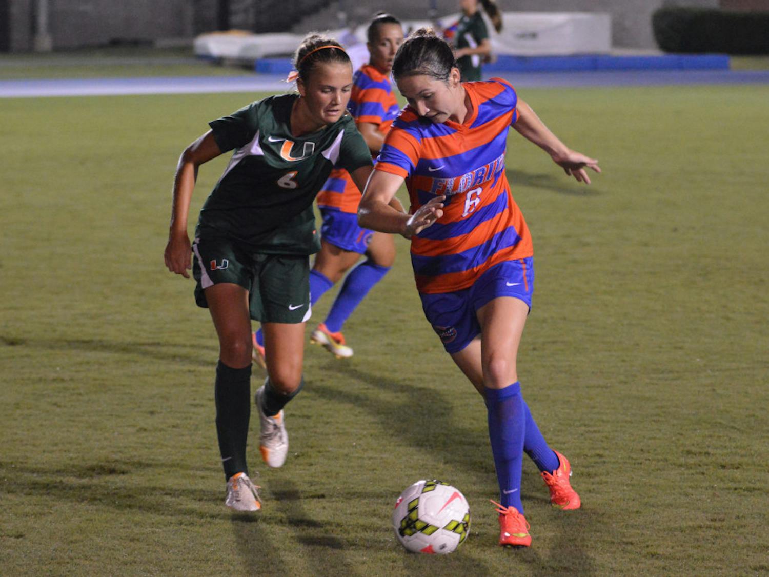 Junior midfielder Lauren Smith dribbles the ball during Florida's 3-0 win against Miami on Friday at James G. Pressly Stadium.