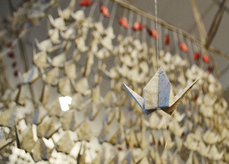 Red paper cranes hang from the ceiling of UF Health Shands Cancer Hospital on Thursday for an art exhibit, “Messages,” created by Elif Ackali, artist and UF associate professor of industrial and systems engineering .