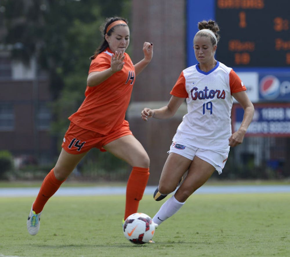 <p>Havana Solaun (19) fights for the ball during Florida’s 2-0 win against Oklahoma State on Sept. 6 at James G. Pressly Stadium.</p>