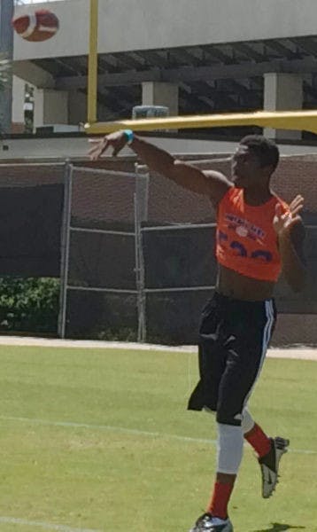Sheriron Jones warms up prior to Saturday's football camp at Sanders Practice Fields. Jones, a four-star dual-threat quarterback from Moreno Valley, Calif., committed to UF on Sunday.