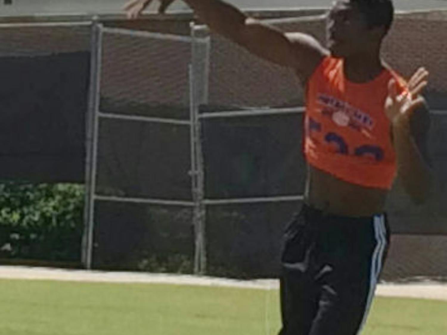 Sheriron Jones warms up prior to Saturday's football camp at Sanders Practice Fields. Jones, a four-star dual-threat quarterback from Moreno Valley, Calif., committed to UF on Sunday.