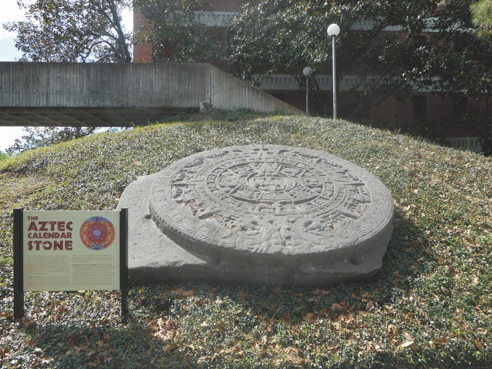 A 24-ton stone replica of one in Mexico City sits in the Dickson Hall courtyard. Susan Milbrath, a curator at the Florida Museum of Natural History, interpreted the stone’s meaning to predict the death of the Aztec sun god, causing apocalyptic earthquakes. 