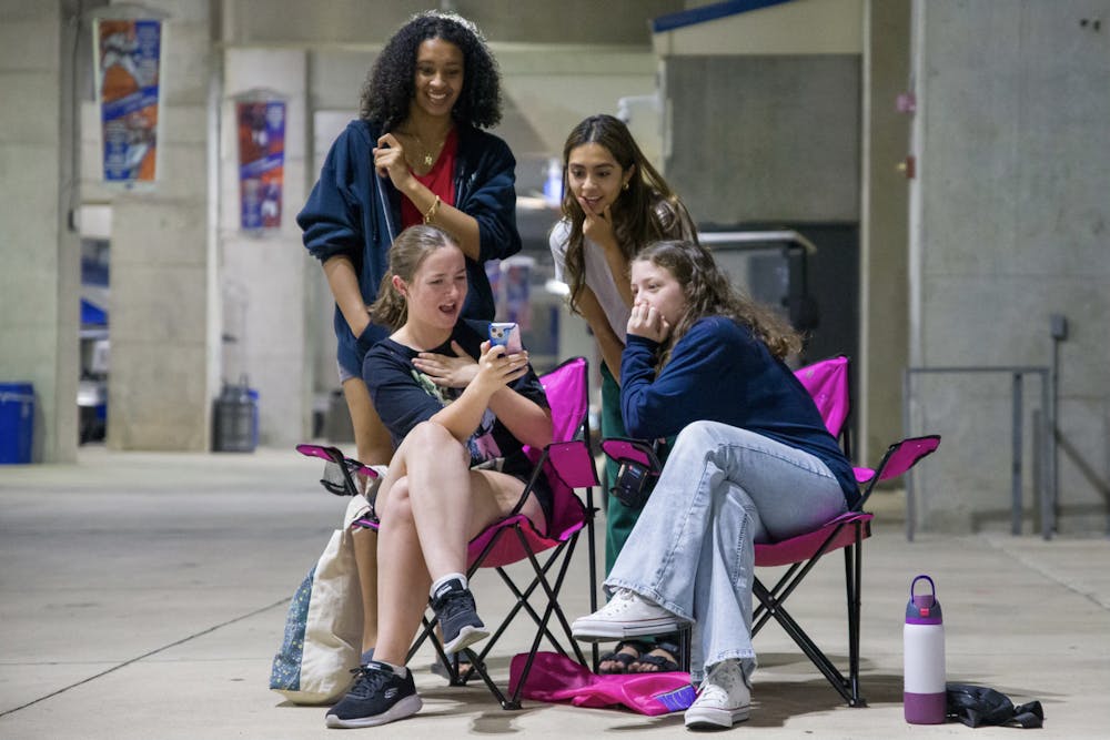 Mahdiya Khan, Annie Farooq, Jessie Babb and Ashley Weekes listen to Taylor Swift’s new album “The Tortured Poets Department” at a listening party thrown at Ben Hill Griffin Stadium on Thursday, April 18, 2024.