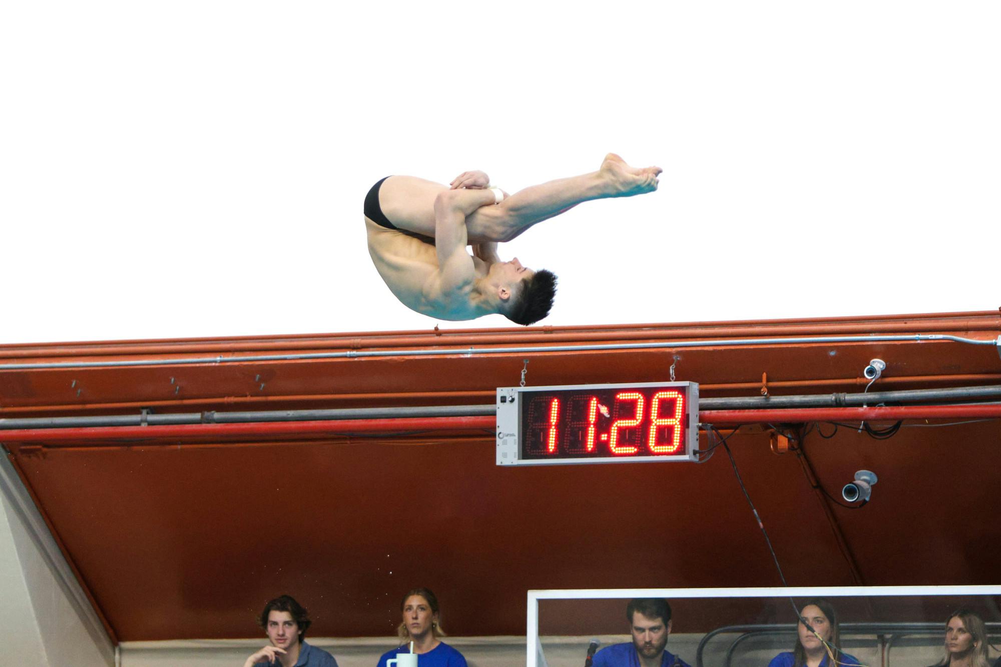 Senior Skip Donald performs in the men’s platform event in the men's and women's diving team meet Friday, January 27, 2024. 