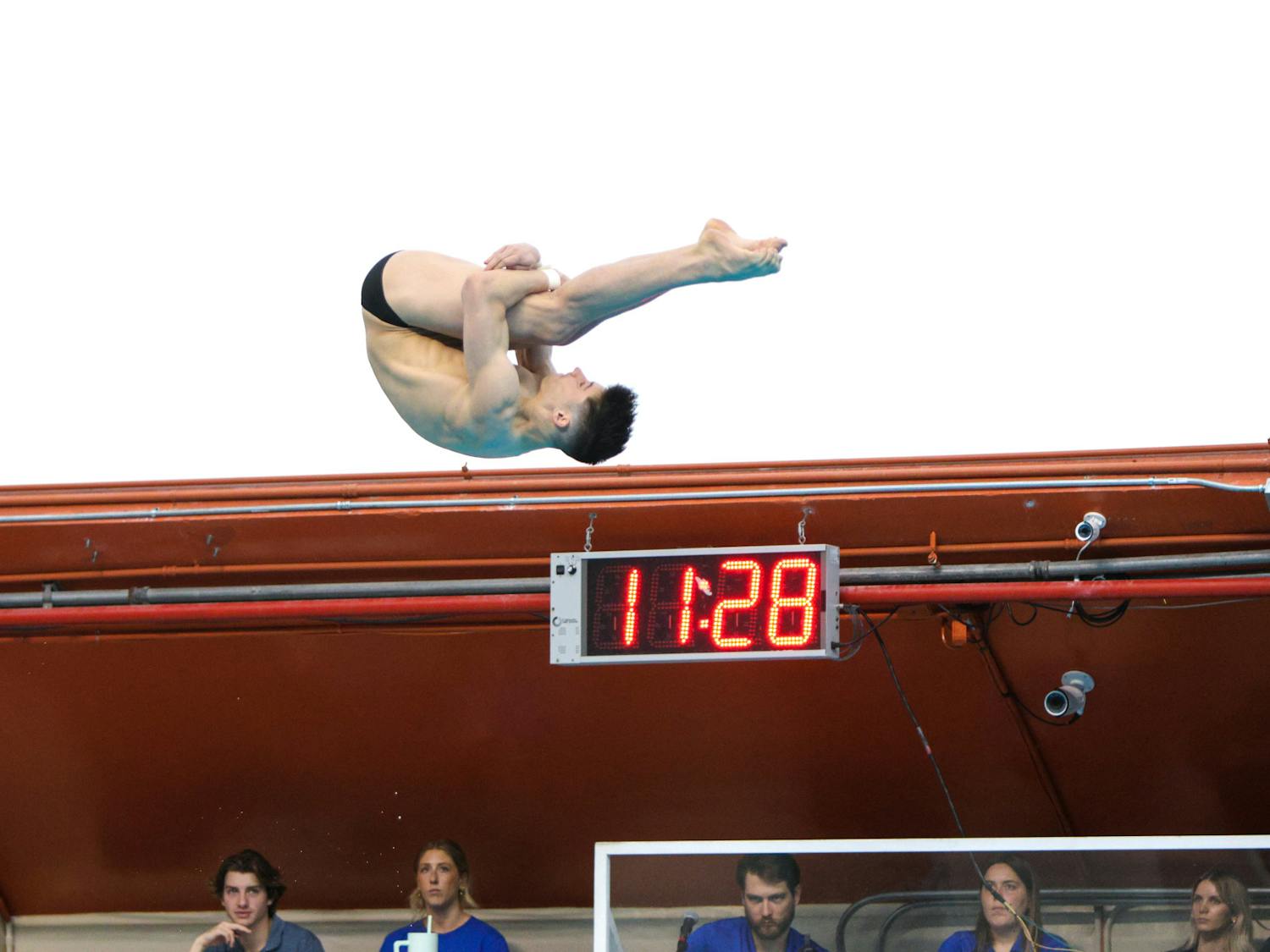 Senior Skip Donald performs in the men’s platform event in the men's and women's diving team meet Friday, January 27, 2024. 