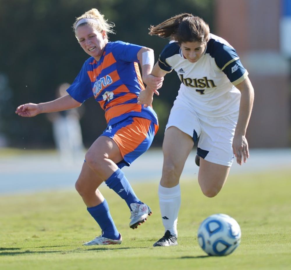 <p>Notre Dame defender Stephanie Campo muscles past Florida defender Tessa Andujar during Florida's 2-0 loss to Notre Dame on Sunday afternoon.</p>