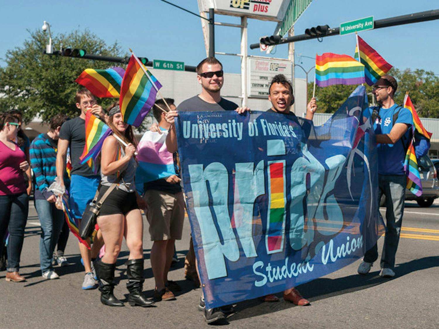 Members of the Pride Student Union at UF march in the Pride parade Saturday afternoon. The event started at Eighth Street and spanned all the way to Bo Diddley Community Plaza.