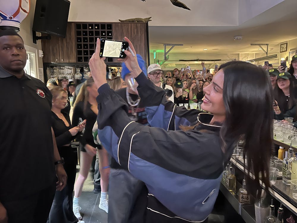 Kendall Jenner poses with fans at The Swamp Restaurant on Wednesday, Feb. 7, 2024.
