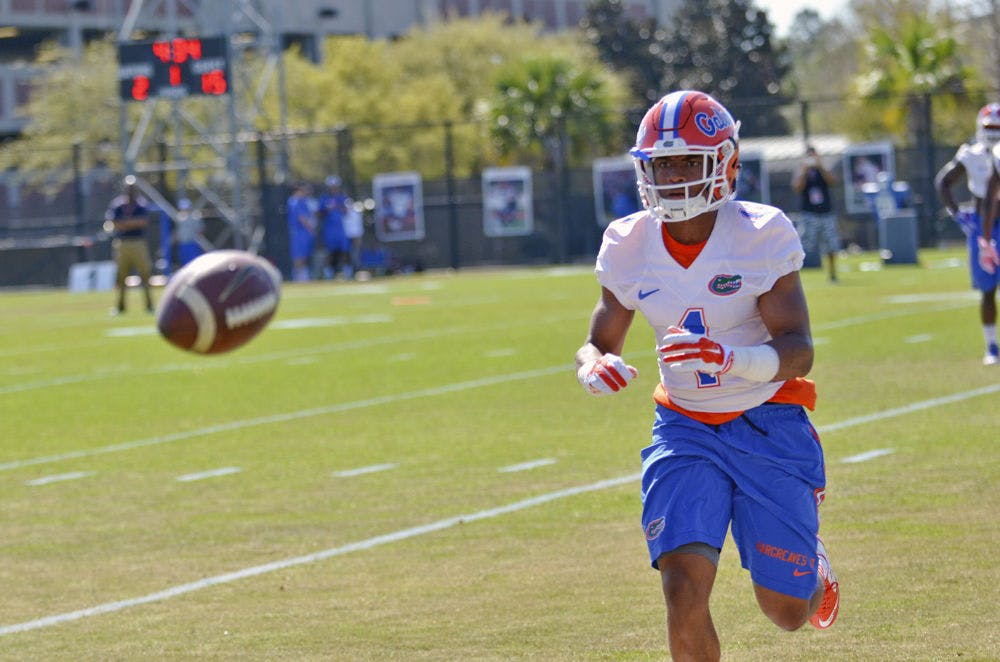 <p>Vernon Hargreaves III runs to catch a ball during practice at Donald R. Dizney Stadium.</p>