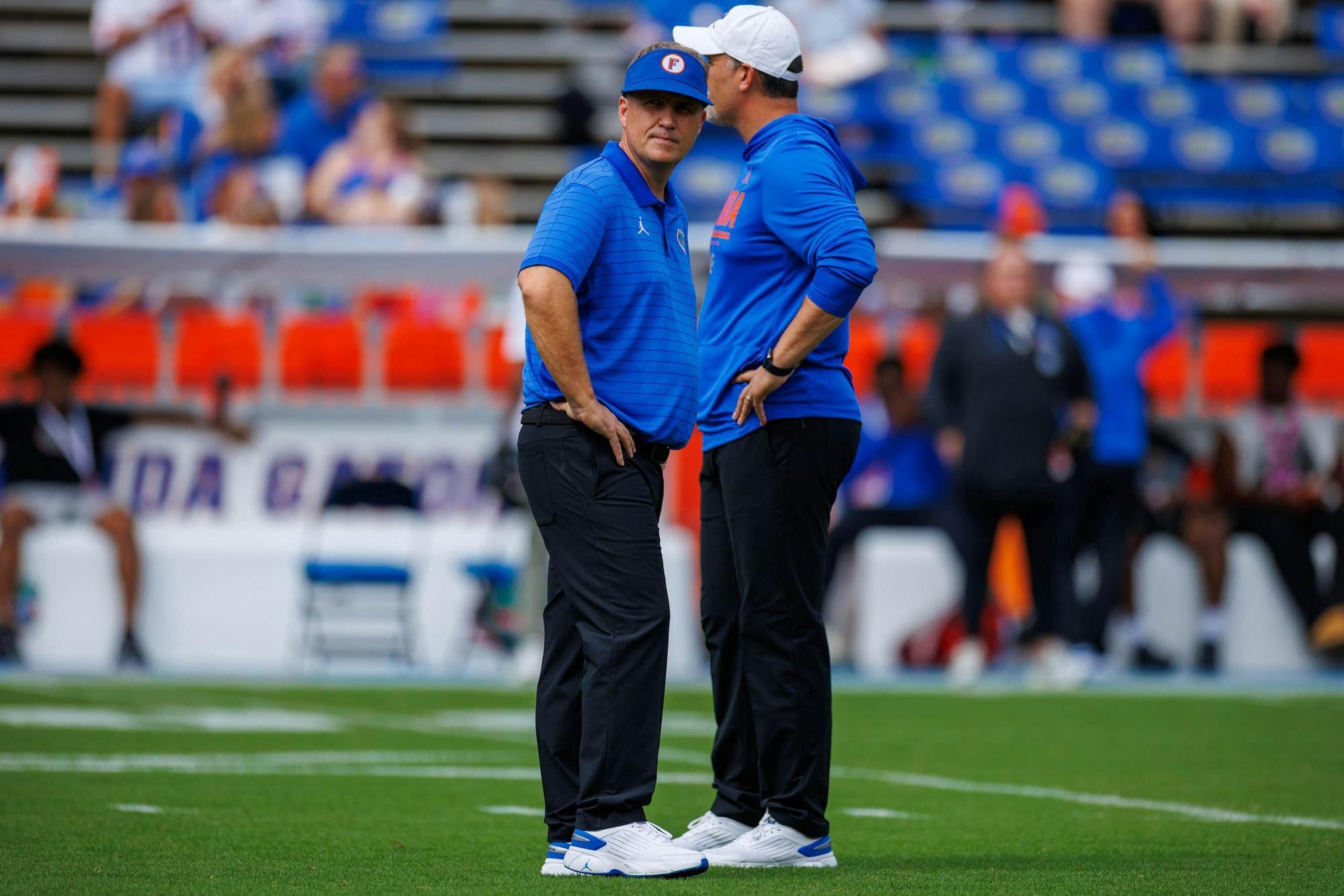 Florida offensive coordinator Buster Faulkner walks on the field before an NCAA college football game against South Carolina, Saturday, Oct. 10, 2026, in Gainesville, Fla.