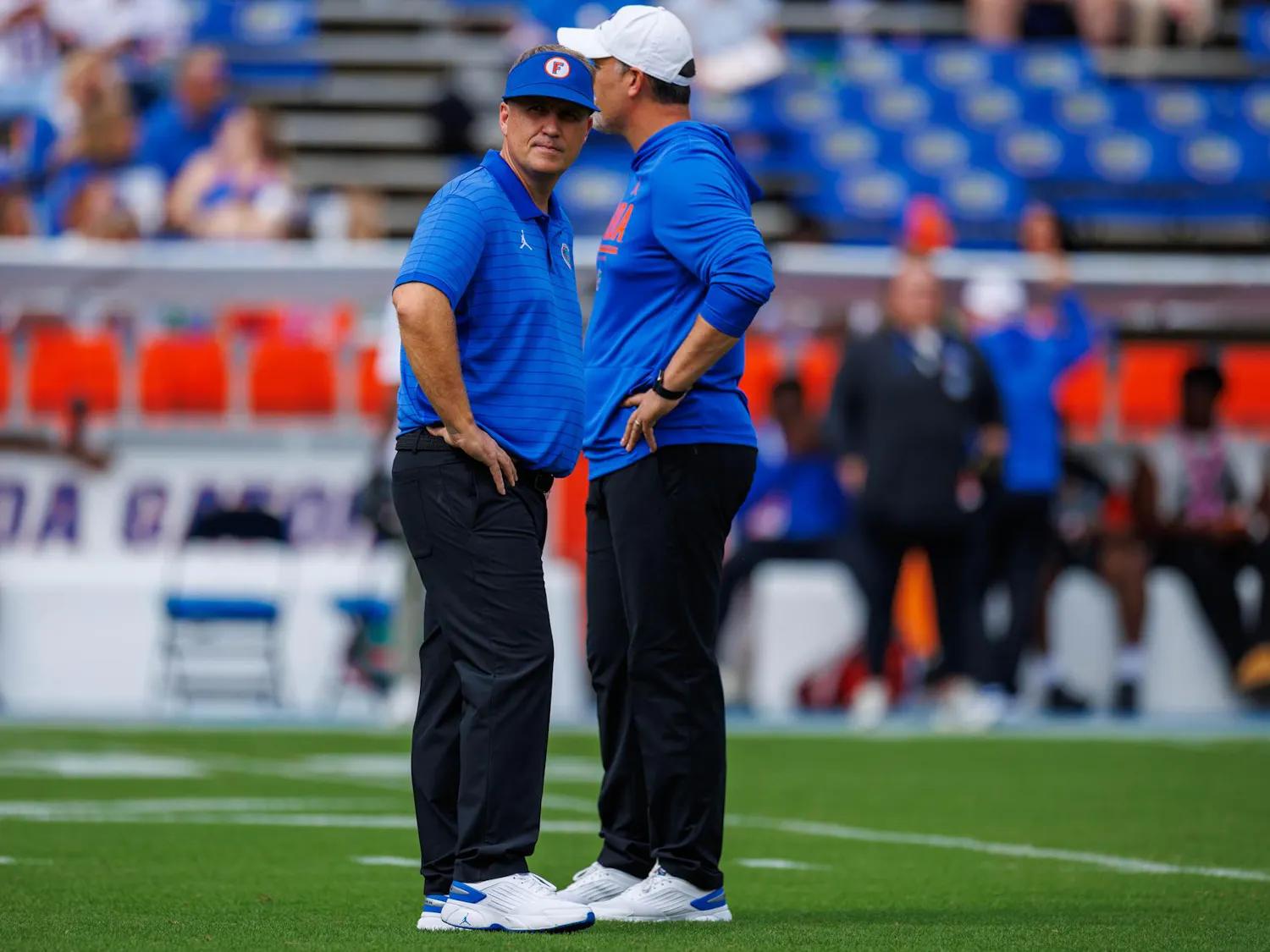 Florida offensive coordinator Buster Faulkner walks on the field before an NCAA college football game against South Carolina, Saturday, Oct. 10, 2026, in Gainesville, Fla.