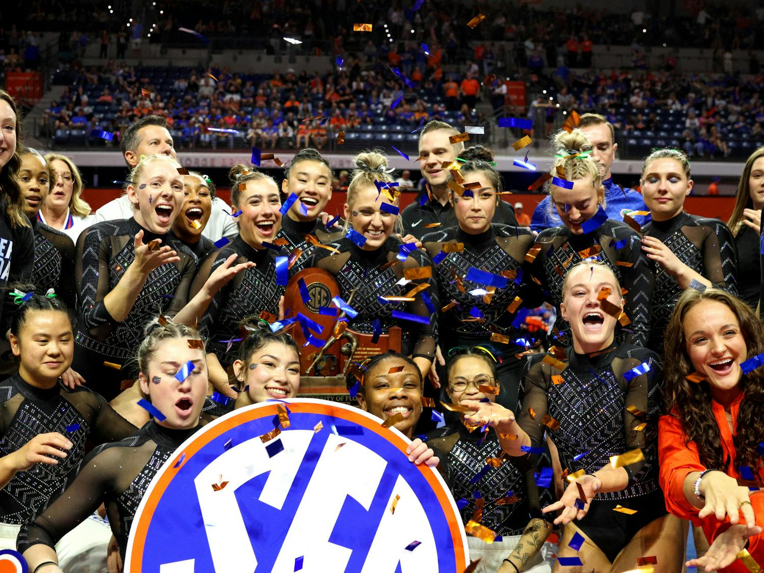 The Florida Gators gymnastics team celebrates its Southeastern Conference championship win following its victory against the Kentucky Wildcats Friday, Feb. 24, 2023.