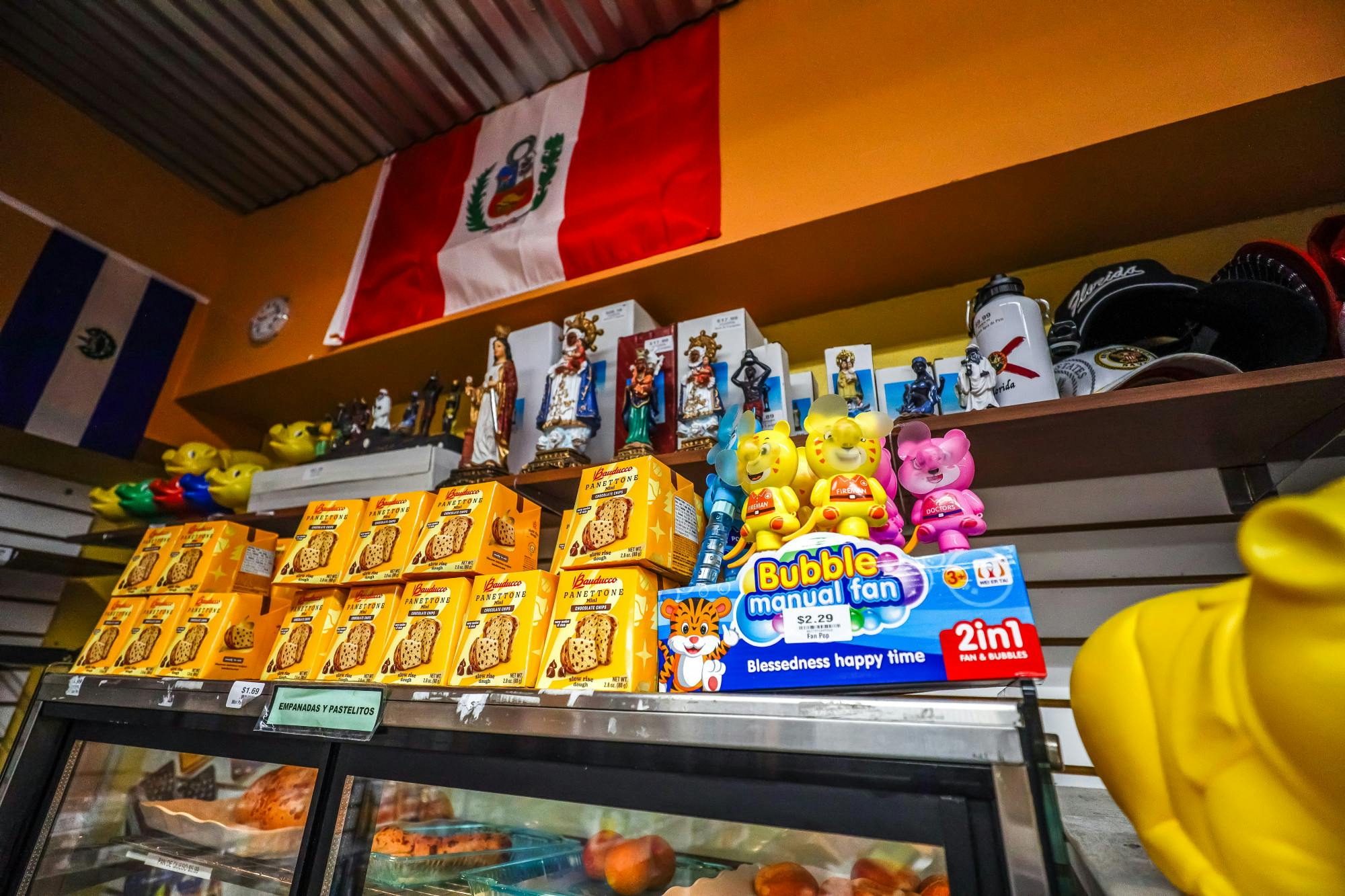 Toys and other items stacked above the bakery section at La Aurora Latin Supermarket on Sunday, April 6, 2025.
