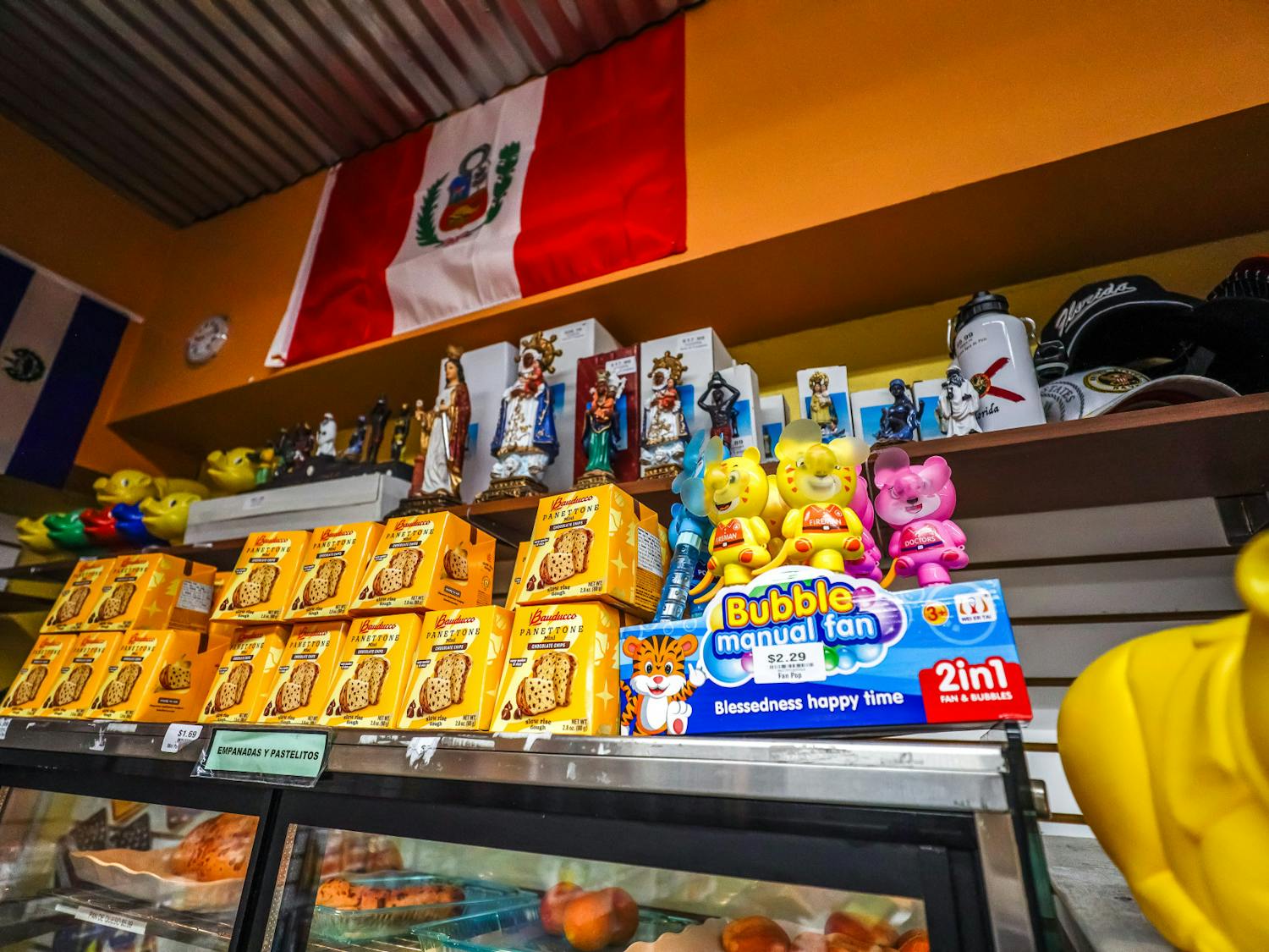 Toys and other items stacked above the bakery section at La Aurora Latin Supermarket on Sunday, April 6, 2025.