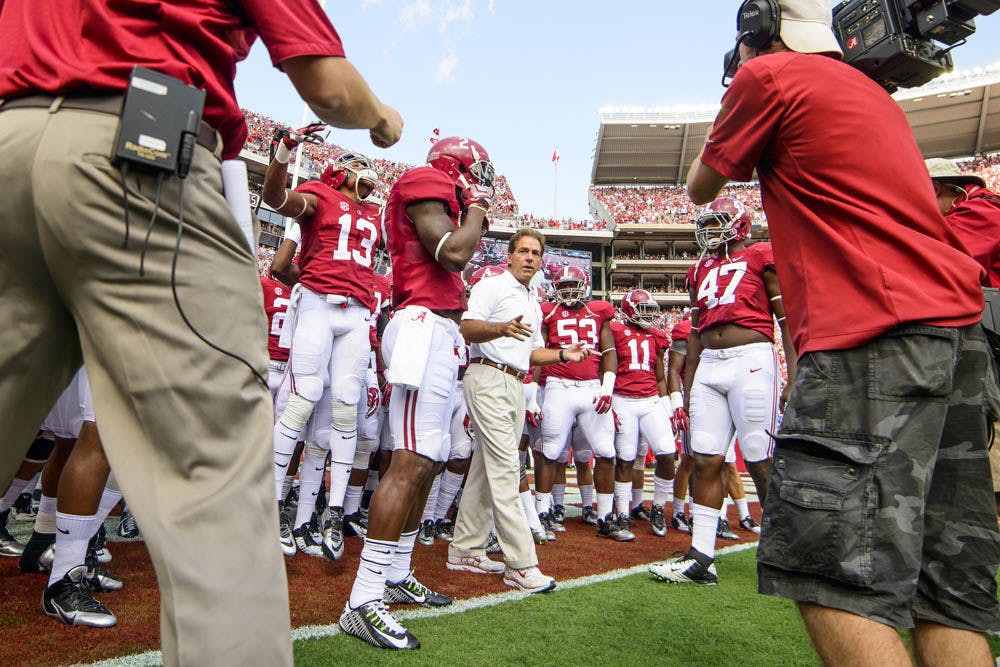 Alabama coach Nick Saban hypes up his team prior to the Crimson Tide's 42-21 win against the Gators on Saturday at Bryant-Denny Stadium.