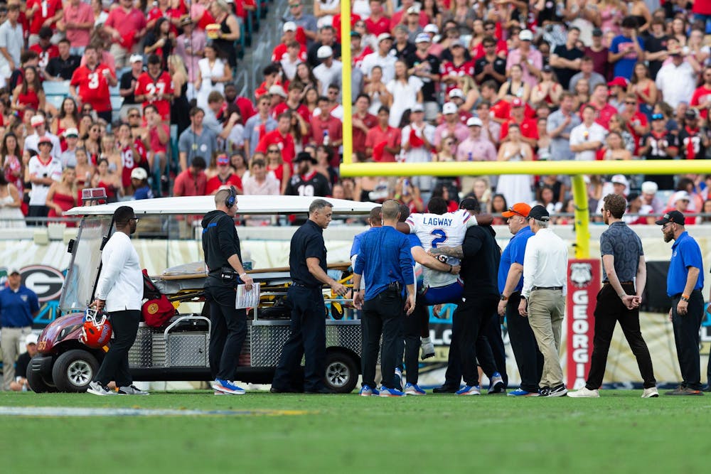 <p>Florida Gators quarterback DJ Lagway (2) gets lifted to a cart after suffering an injury during the first half at TIAA Bank Field on Saturday, November 02, 2024.</p>