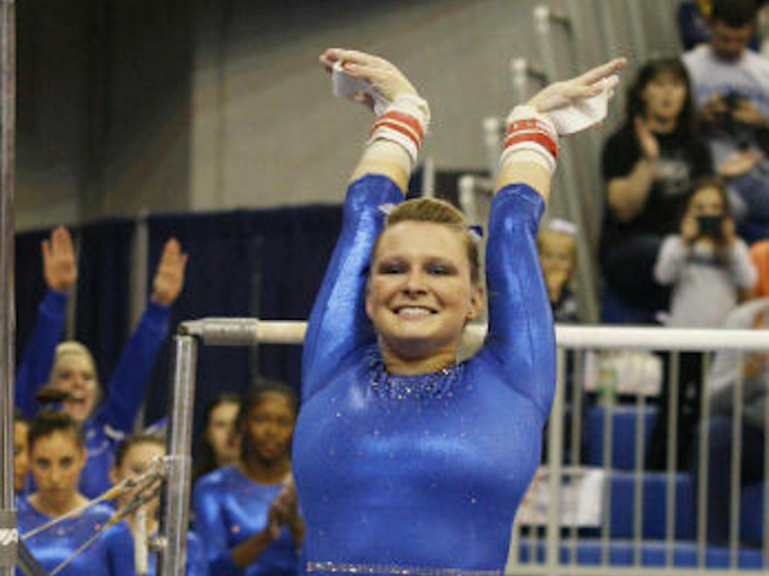 Bridget Sloan sticks a landing during Florida’s 196.575-190.55 win against Ball State on Jan. 4, 2013, in the O’Connell Center. Sloan won two events when Florida faced Georgia in the NCAA Super Six.