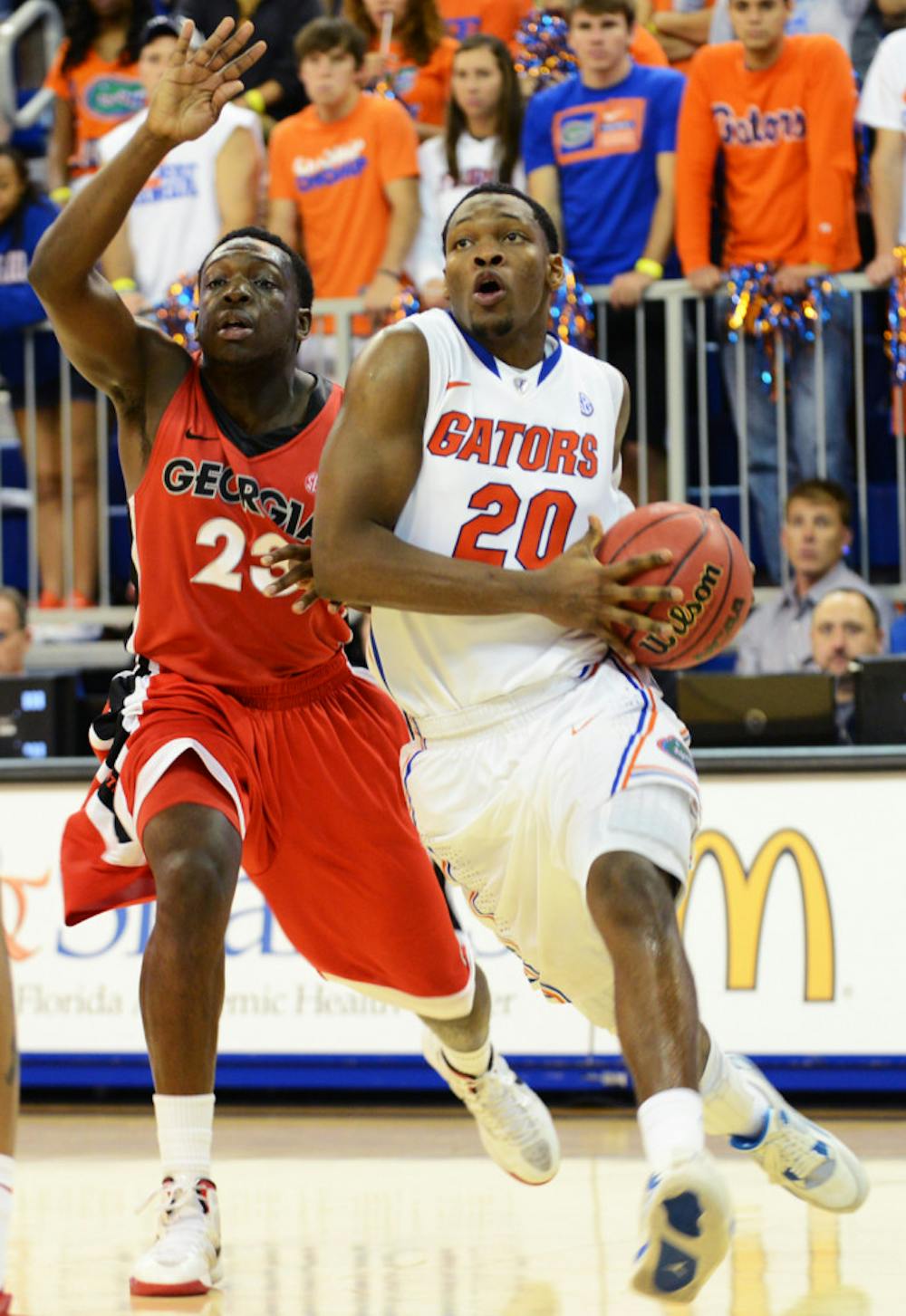 <p>Guard Michael Frazier II (20) drives toward the hoop during Florida’s 77-44 win against Georgia on Jan. 9 in the O’Connell Center. </p>