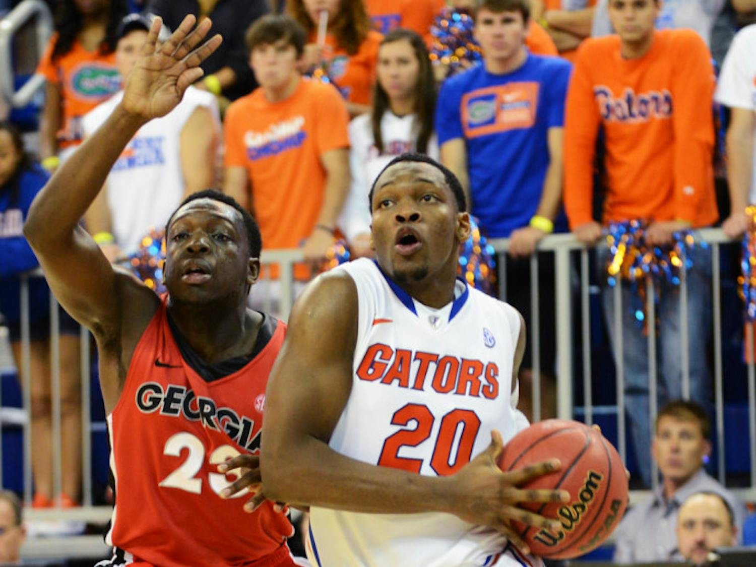 Guard Michael Frazier II (20) drives toward the hoop during Florida’s 77-44 win against Georgia on Jan. 9 in the O’Connell Center.