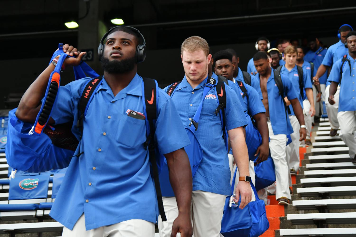 From left: Jarrad Davis, Steven Stipe and the rest of Florida's football team descend into The Swamp prior to UF's 32-0 win over North Texas on Sept. 17, 2016.