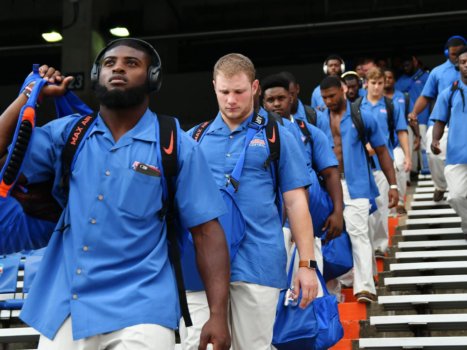 From left: Jarrad Davis, Steven Stipe and the rest of Florida's football team descend into The Swamp prior to UF's 32-0 win over North Texas on Sept. 17, 2016.
