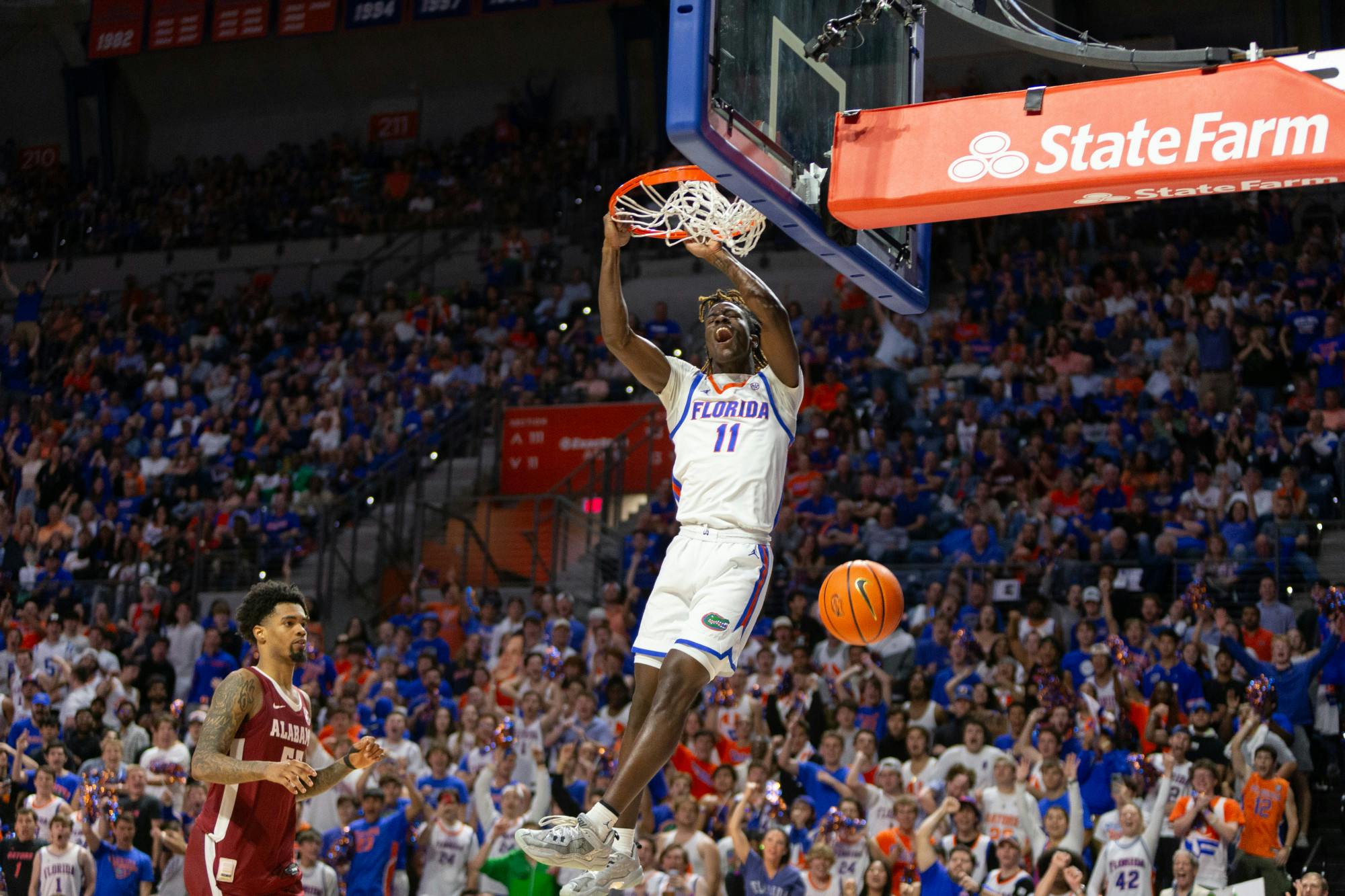  Florida sophomore Denzel Aberdeen makes a dunk against the Alabama Crimson Tide on Tuesday, March 5. Photo by Ryan Friedenberg