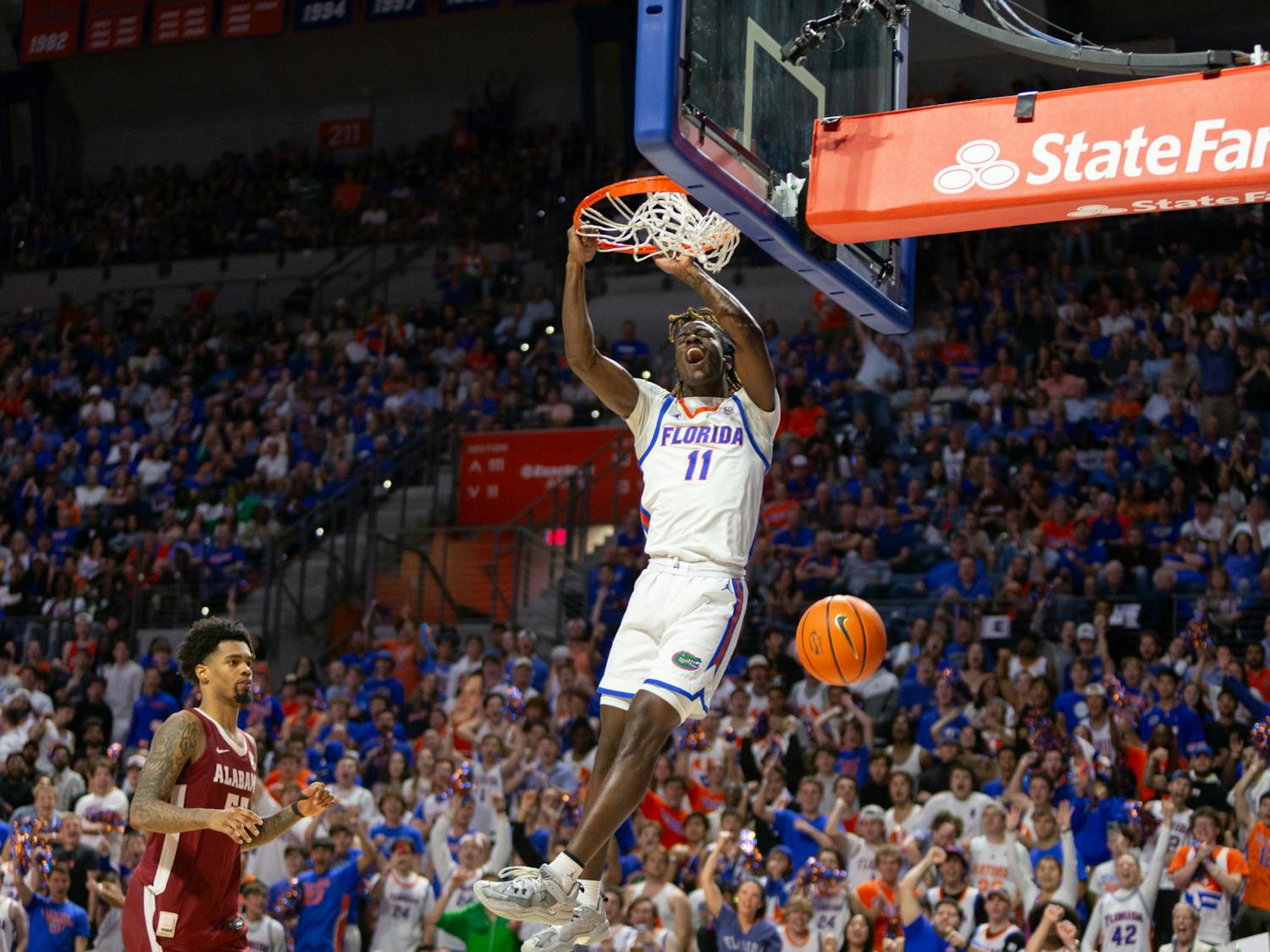  Florida sophomore Denzel Aberdeen makes a dunk against the Alabama Crimson Tide on Tuesday, March 5. Photo by Ryan Friedenberg