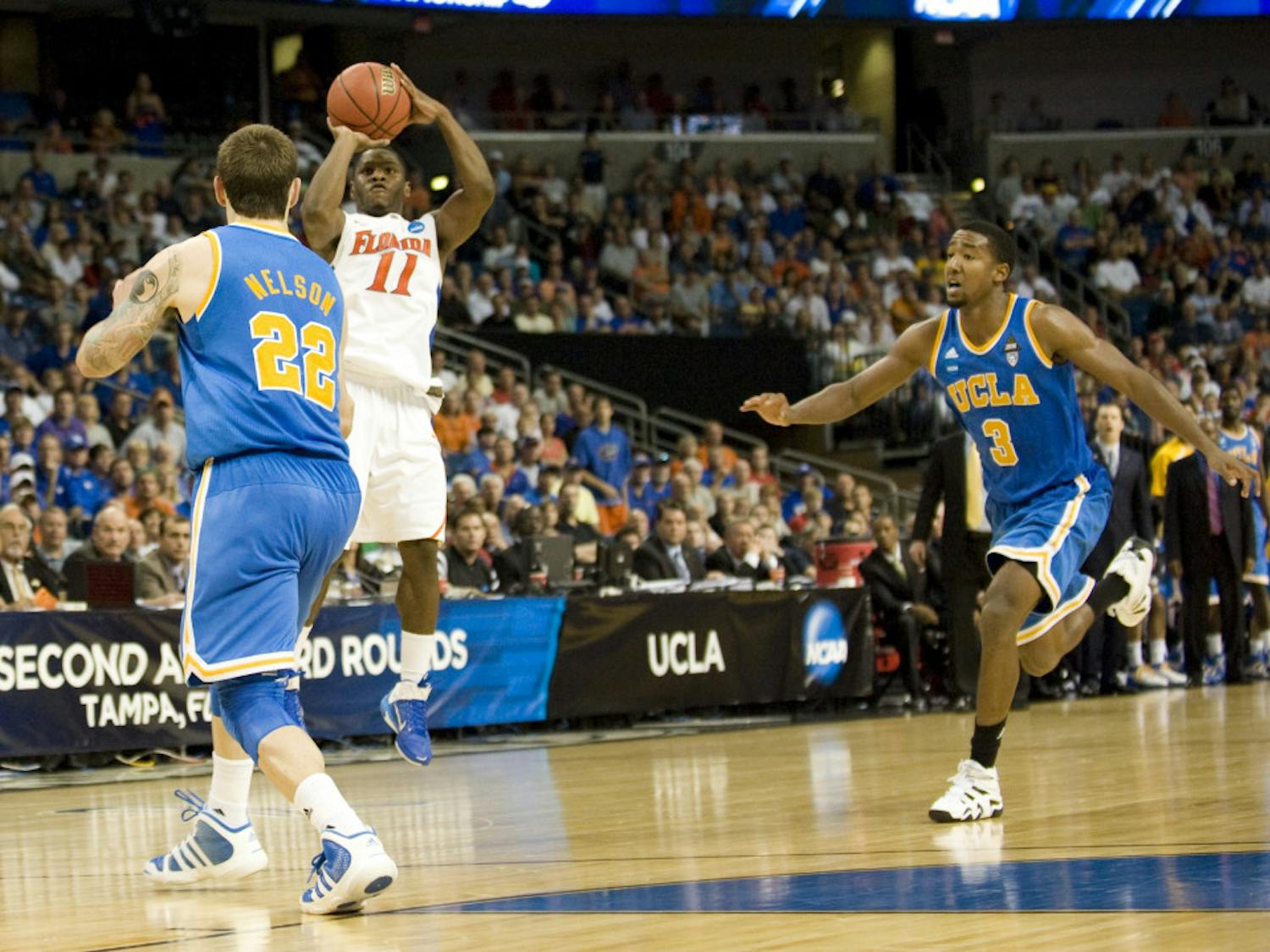 Gator guard Erving Walker sinks a three late in Florida's 73-65 win over UCLA in the St. Pete Times Forum in Tampa on Saturday. Walker racked up 21 points and propelled UF into the Sweet 16.