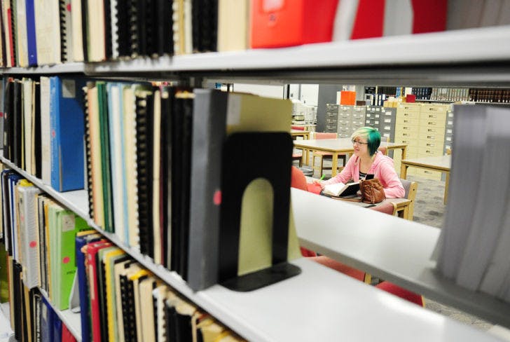 Shae Rollins, a 19-year-old UF biological engineering freshman, takes a study break with friends in Marston Science Library.