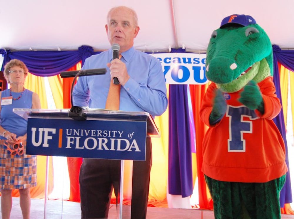 <p>UF President Bernie Machen, seen here speaking in October at the BEAT Lousiana State University T-shirt distribution, is not stepping down from his position at this time.</p>
