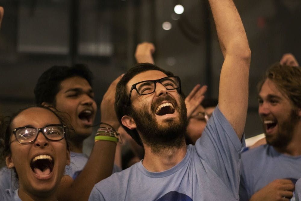 Inspire President Zachary Amrose celebrates Wednesday night as Inspire won the majority of open seats. 