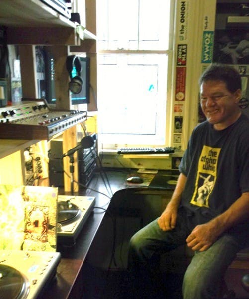 Grow Radio founder Bill Bryson sits in his radio studio located in downtown Gainesville.