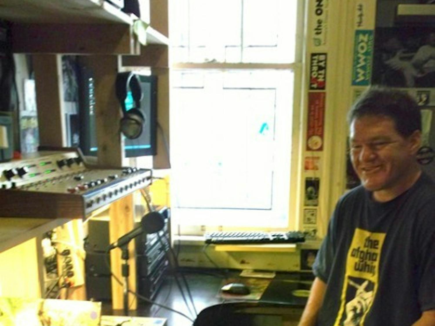 Grow Radio founder Bill Bryson sits in his radio studio located in downtown Gainesville.
