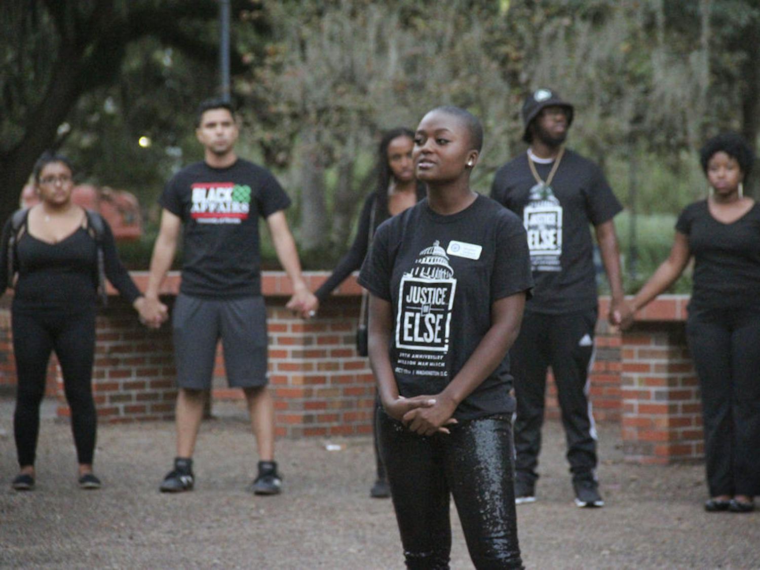Heather Monae Jackson, a 20-year-old UF business management senior and action co-chair of the Gator chapter of the National Association for the Advancement of Colored People, stands in the middle of a demonstration on Turlington Plaza on Nov. 11, 2015, in support of University of Missouri students. “The primary message of the new generation is 'Justice or Else,'” she said, “and that is what this rally was about.”