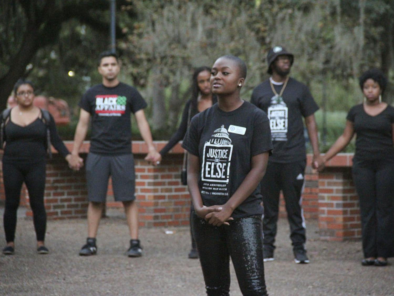Heather Monae Jackson, a 20-year-old UF business management senior and action co-chair of the Gator chapter of the National Association for the Advancement of Colored People, stands in the middle of a demonstration on Turlington Plaza on Nov. 11, 2015, in support of University of Missouri students. “The primary message of the new generation is 'Justice or Else,'” she said, “and that is what this rally was about.”