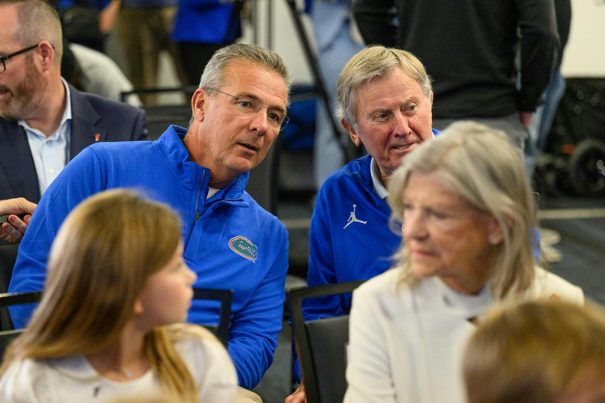 Former Florida football head coaches Urban Meyer and Steve Spurrier talk before Jon Sumrall’s introductory press conference at Heavener Football Training Center in Gainesville, Fla., Monday, Dec. 1, 2025.