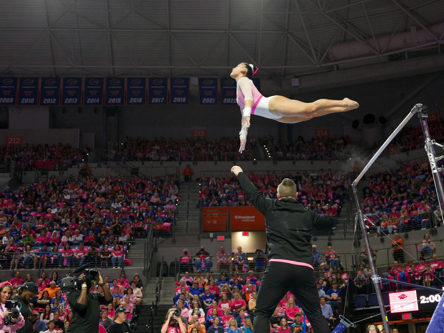 Junior Leanne Wong competes in her uneven bars routine in the Gators gymnastics Annual Link to Pink meet on Friday, February 9, 2023.