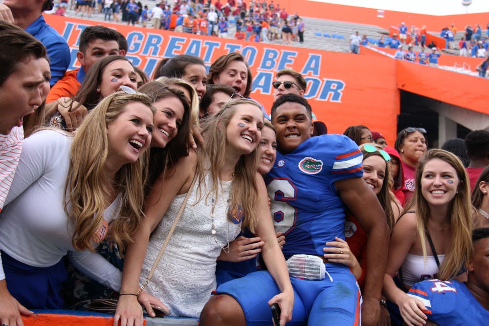 <p>Quincy Wilson celebrates with fans after Florida's 20-7 win over South Carolina on November 12, 2016, at Ben Hill Griffin Stadium.</p>