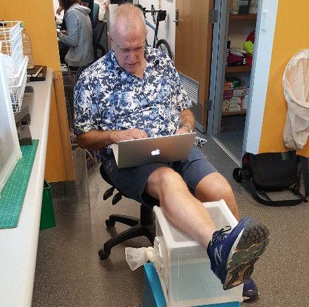 Barukh Rohde's mentor Scott Ritchie, a UF entomology Ph.D. graduate, "feeding mosquitoes" in a box under his leg.