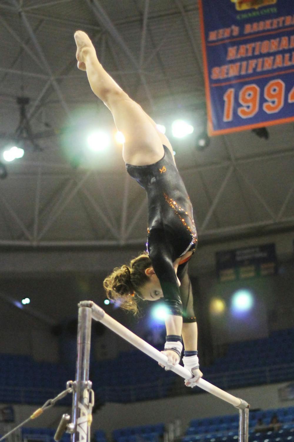 <p class="p1"><span class="s1">Kiersten Wang performs on the uneven parallel bars in Florida’s win against Kentucky on Feb 22.</span></p>
