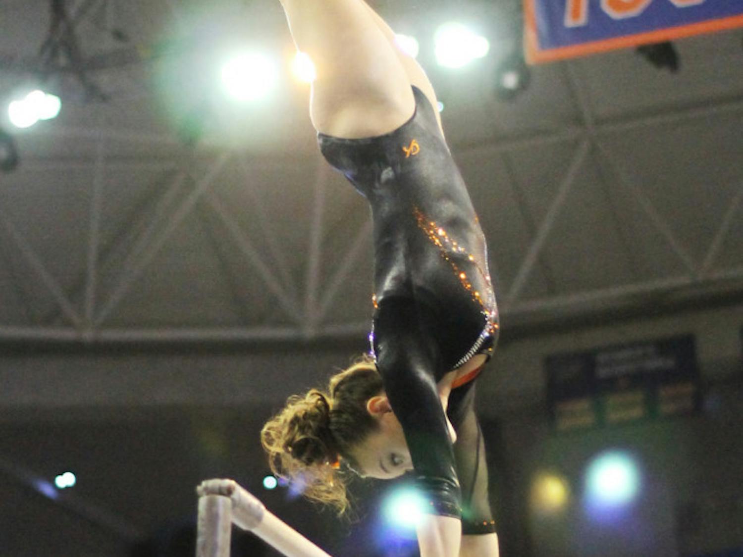 Kiersten Wang performs on the uneven parallel bars in Florida’s win against Kentucky on Feb 22.